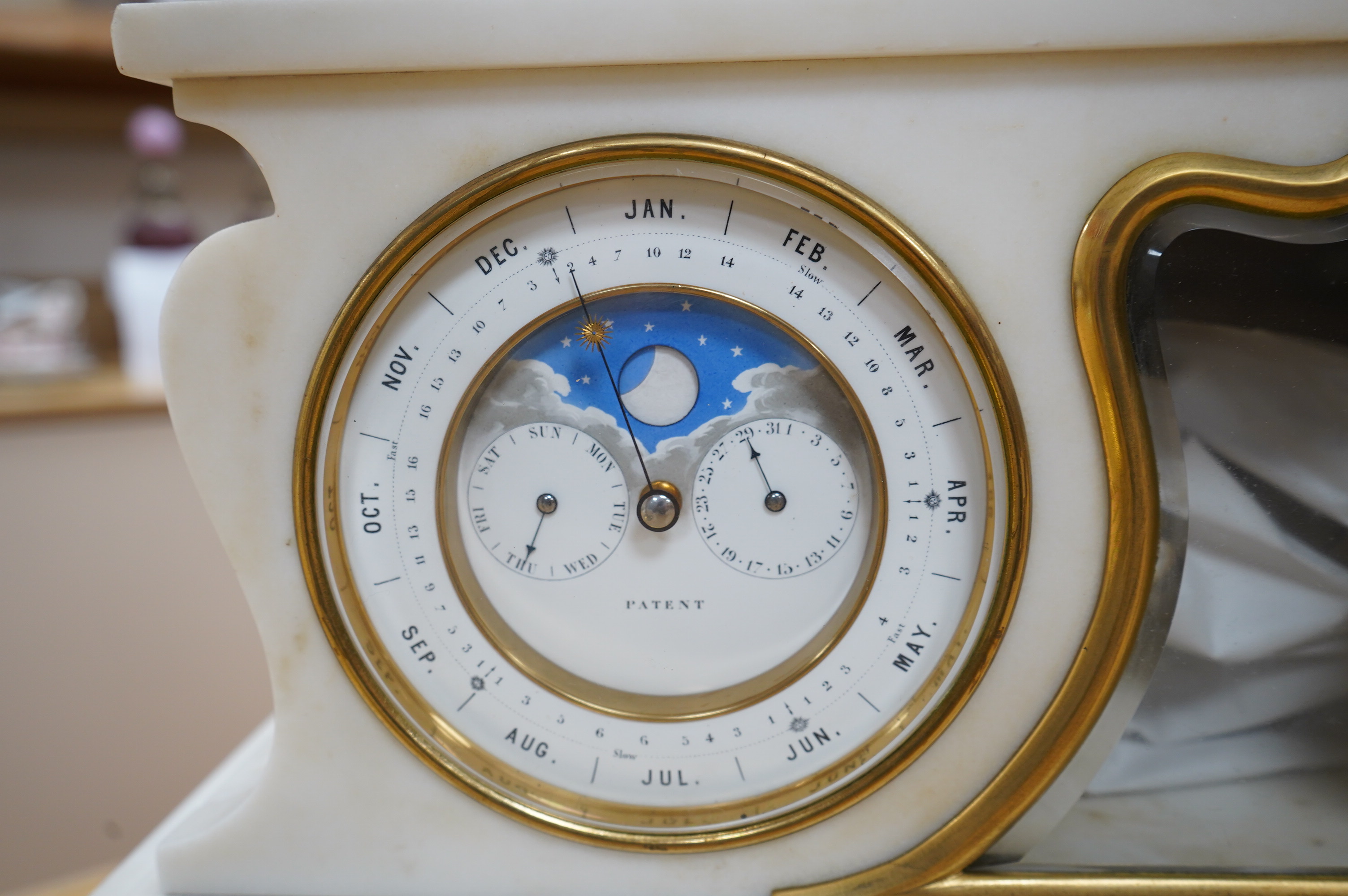 A good late 19th century white marble combination mantel clock, calendar and barometer, with sweep seconds hand, 52cm wide. Condition - fair to good